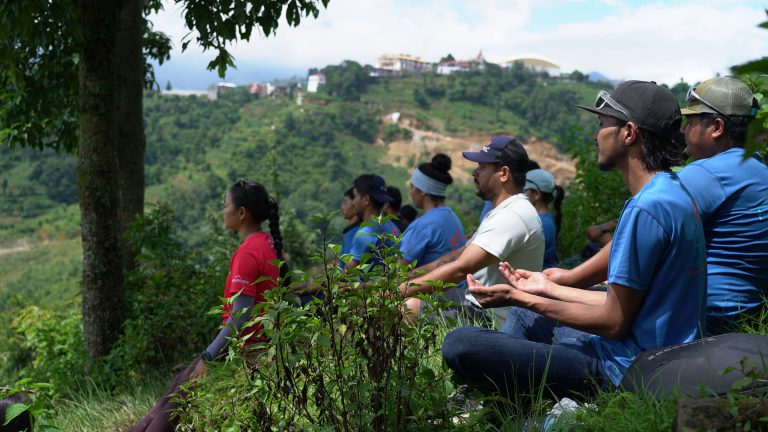 Volunteers overlooking a hillside village in Nepal
