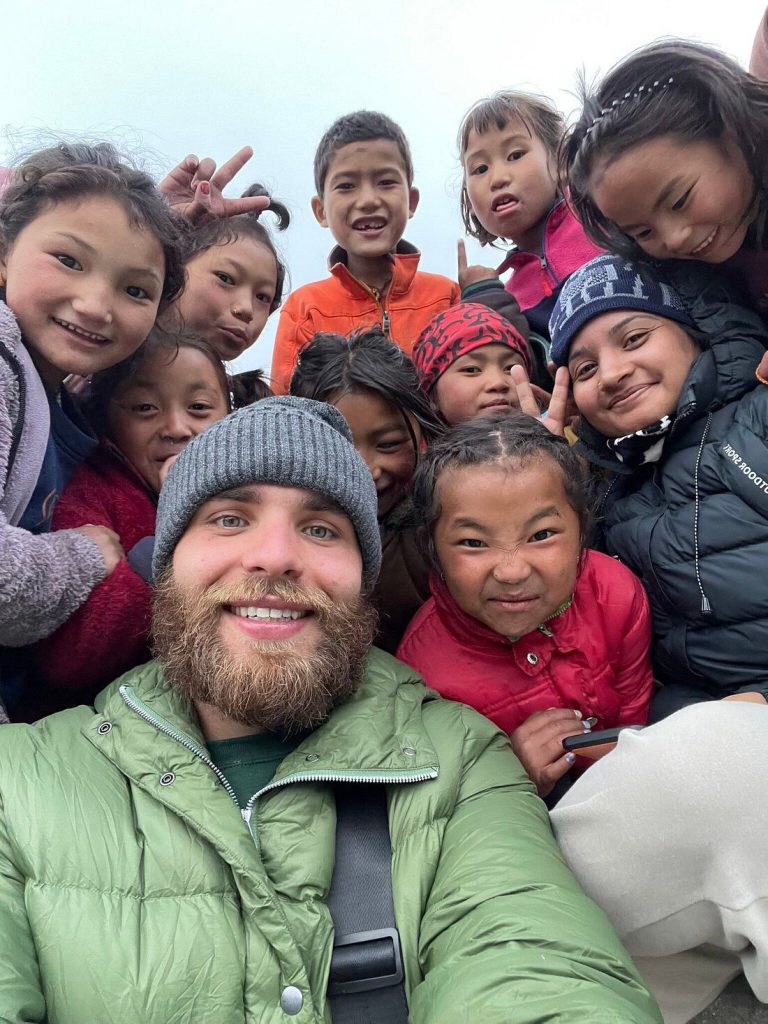 Volunteer with village children